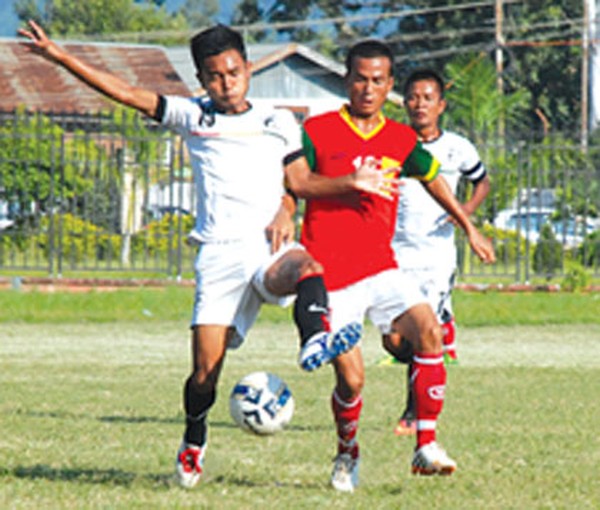 ZFC (white) and TRAU players battle for the ball