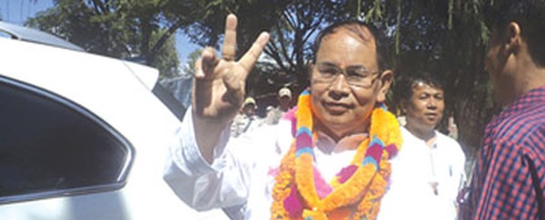 An elated Dwijamani poses with the victory sign after the result was declared 