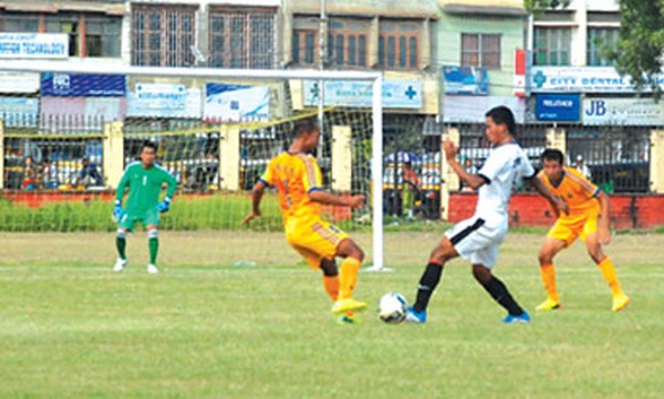 ZFC (white) player competes SSU players for the ball possession