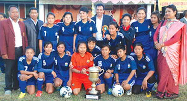 Players and officials of Biramangol College, Sawombung pose for the lens with the trophy