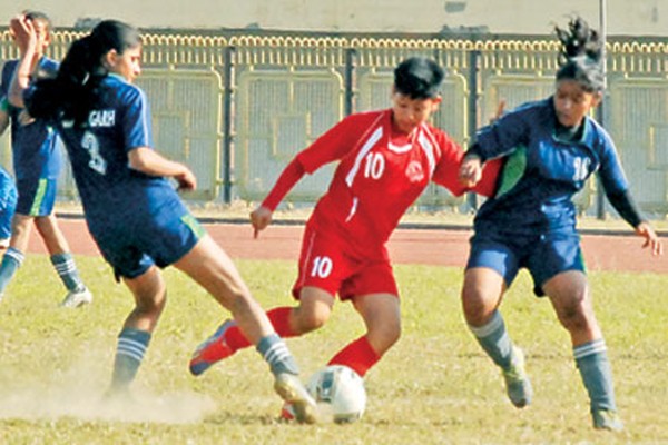 Manipur and Chandigarh players challenge for ball possession