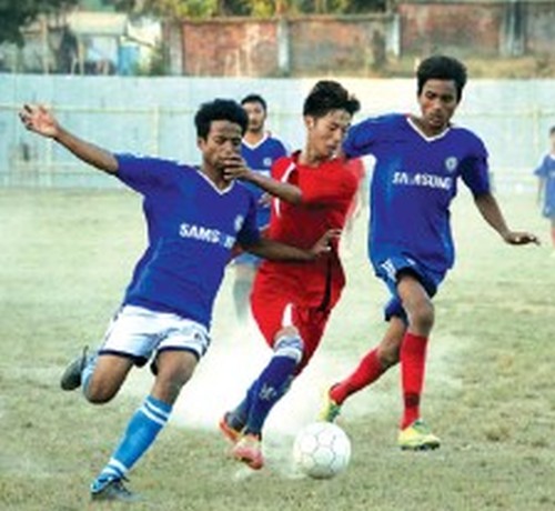 Brethren Sporting Club and Oriental Club players vie for the ball 