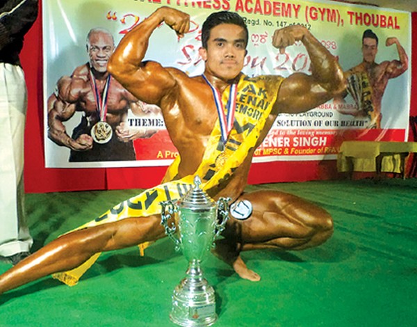 N Suraj pose with the trophy 