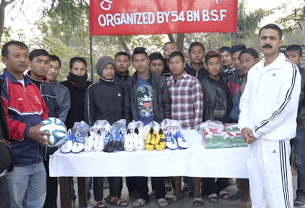 BSF officers distributing sports materials 