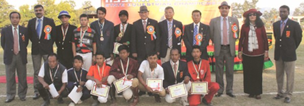 Officials and winners of the Tent pegging and show jumping events pose for the camera 