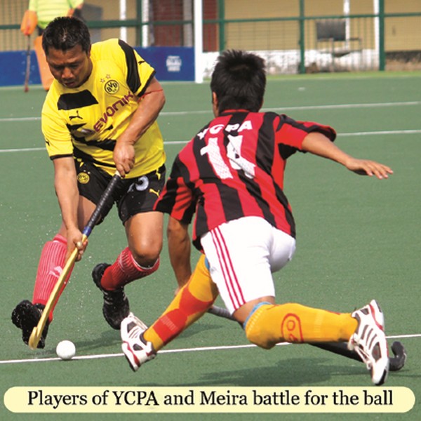 Players of YCPA and Meira battle for the ball 