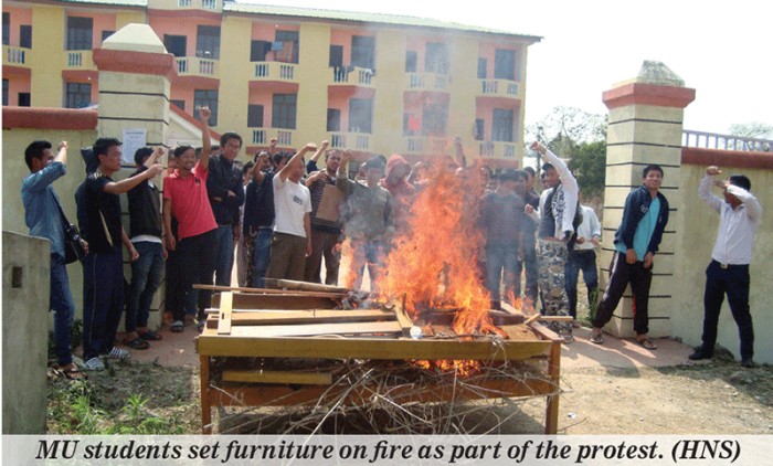 MU students set furniture on fire as part of the protest