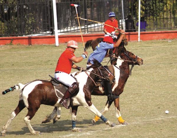 MPSC-A and Tekcham Polo Club players challenge for ball possession 