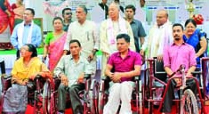Gehlot distributing aids and appliances to differently able persons 