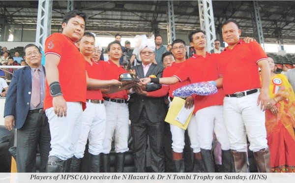 Players of MPSC (A) receive the N Hazari & Dr N Tombi Trophy on Sunday