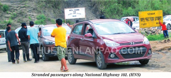 Stranded passengers along National Highway 102