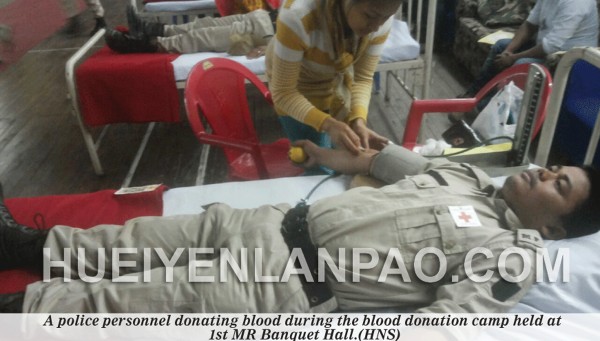 A police personnel donating blood during the blood donation camp held at  1st MR Banquet Hall 