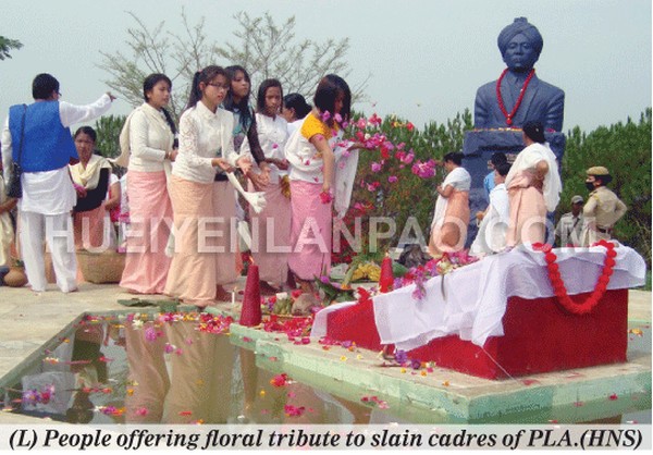 People offering floral tribute to slain cadres of PLA