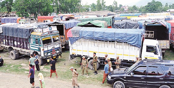 Policemen supervising movement of vehicles requisitioned for the polls