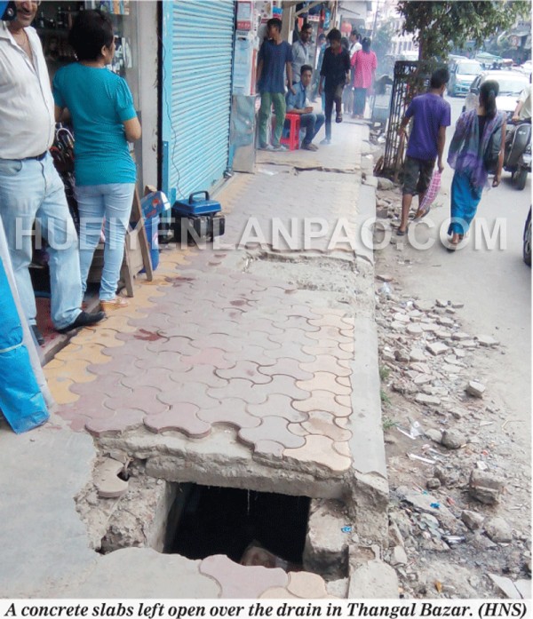 A concrete slabs left open over the drain in Thangal Bazar
