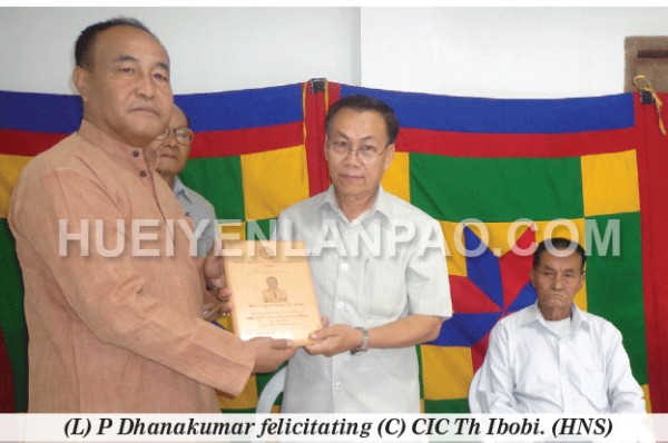 (L) P Dhanakumar felicitating (C) CIC Th Ibobi