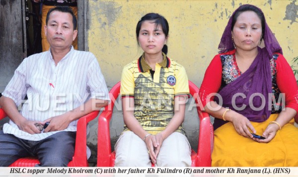 HSLC topper Melody Khoirom (C) with her father Kh Fulindro (R) and mother Kh Ranjana (L)