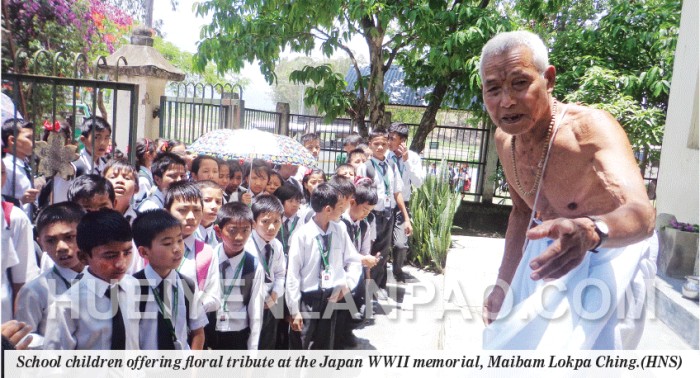 School children offering floral tribute at the Japan WWII memorial, Maibam Lokpa Ching