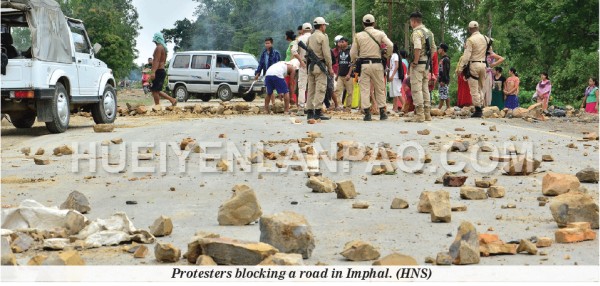 Protesters blocking a road in Imphal