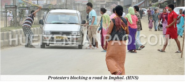 Protesters blocking a road in Imphal