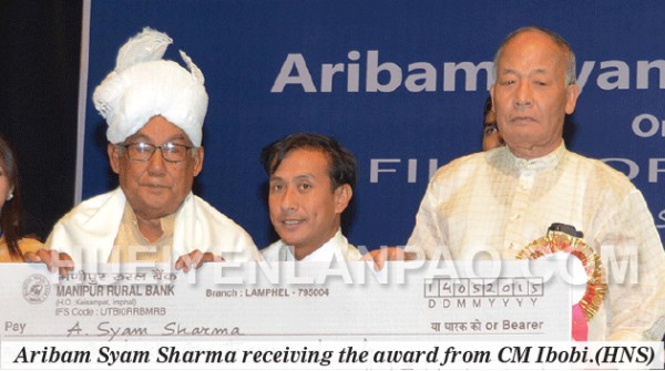 Aribam Syam Sharma receiving the award from CM Ibobi