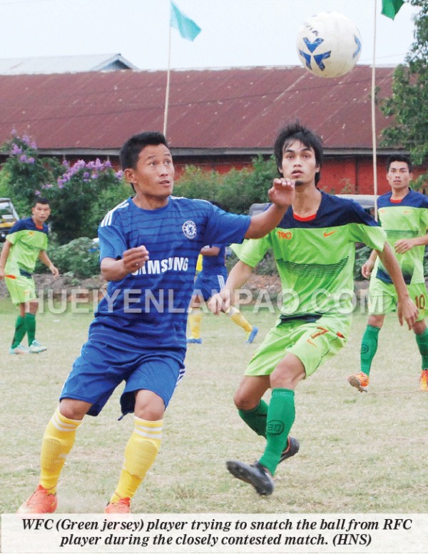 WFC (Green jersey) player trying to snatch the ball from RFC player during the closely contested match