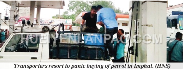 Transporter buying petrol in IMphal