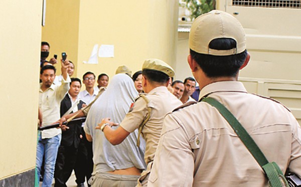 The accused being brought to Court on June 9