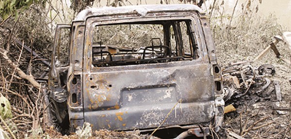 The burnt vehicle of the accused