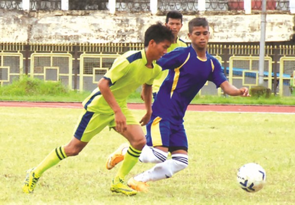 Players of Little Master Eng HSS, IW and Jiribam HSS, Jiribam vie for the ball during U-17 G-A match
