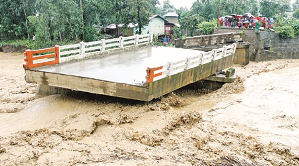 A bridge devastated by the flood water