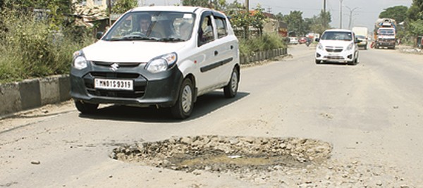 A broken road surface at Imphal city