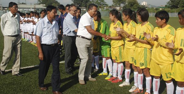 Dignitaries inspecting players before the opening match