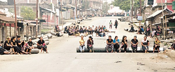 Womenfolk blocking road at Churachandpur