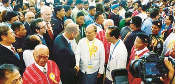 Thein Sein with yellow ribbon greets observers-Hindustan Times