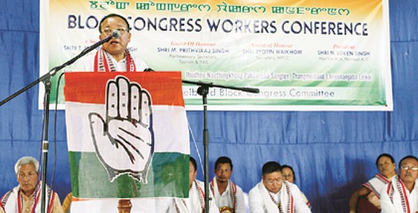 A Congress leader speaks at the political conference