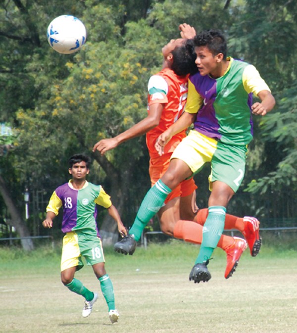 NEROCA FC and NACO players vie for the ball