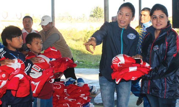 Boxing kits being distributed to the players of Sarita Regional Boxing Academy