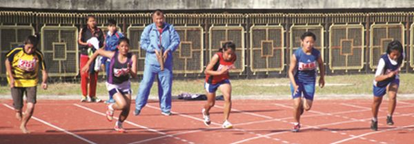 Athletes in action during 100 m race
