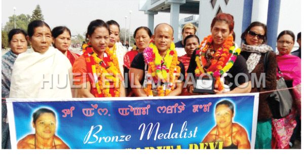 Manipur body builders Th Sarita, K Rebita and L Robert given a warm reception at the Imphal International Airport 