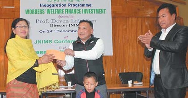 Prof Deven Laishram, Director, JNIMS distributing loan to a beneficiary
