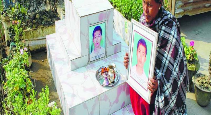 Late Ch Sanjit's mother mourns at his son's tomb (File)