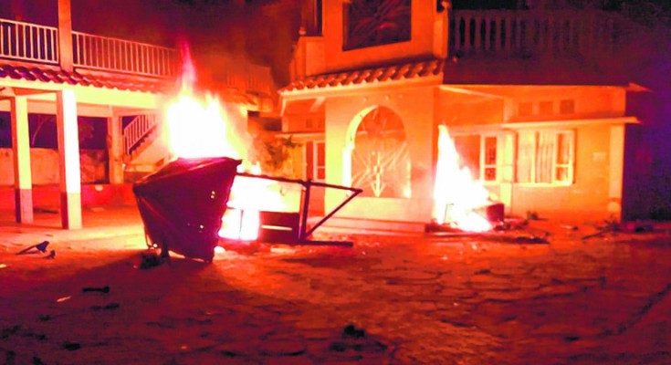 House of an MLA being burnt at CCpur after the three Bills were passed last year-File photo