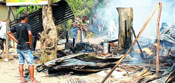 The gutted remains of a structure during the clash