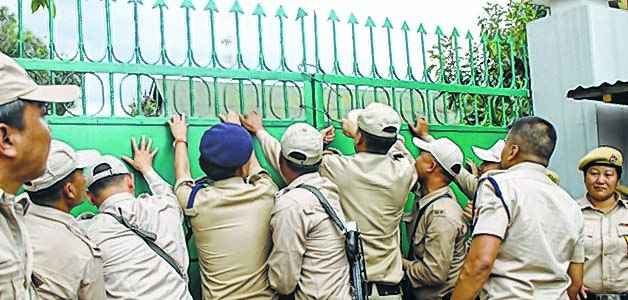 Police locking the gate of TG HSS
