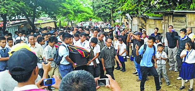 Students carrying the coffin of the deceased teacher