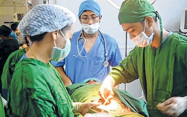 Doctors operating a patient during the 11th Surgical Outreach Mission at Tamenglong.