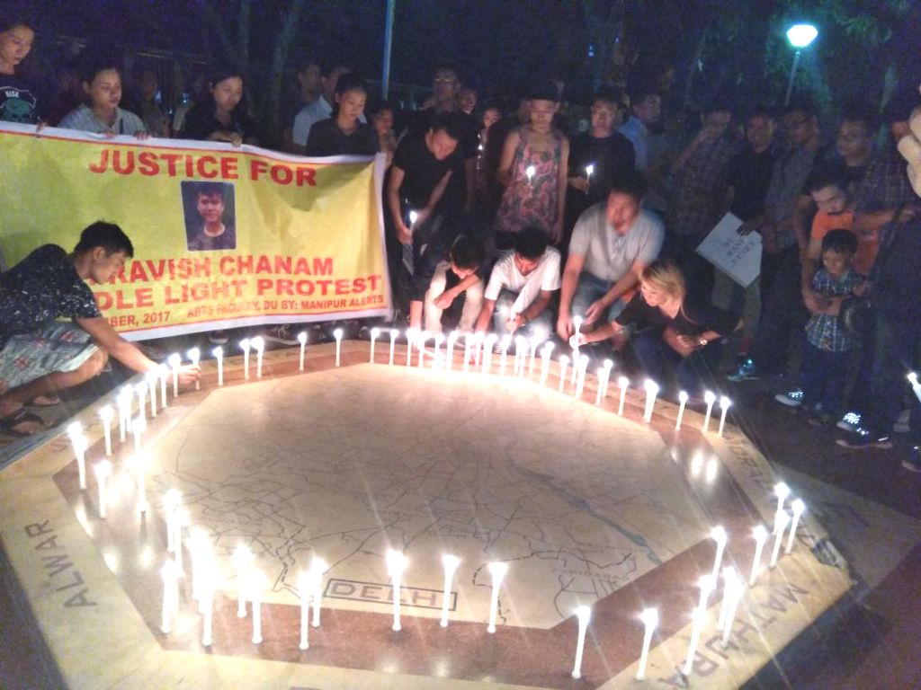 a candle light protest on theme Justice for Pravish Chanam