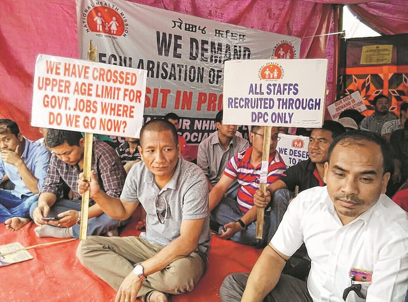 NHM employees hold dharna, demand regularisation