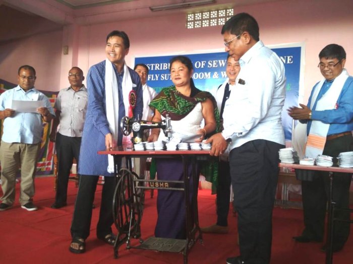 Minister distributes Sewing Machine